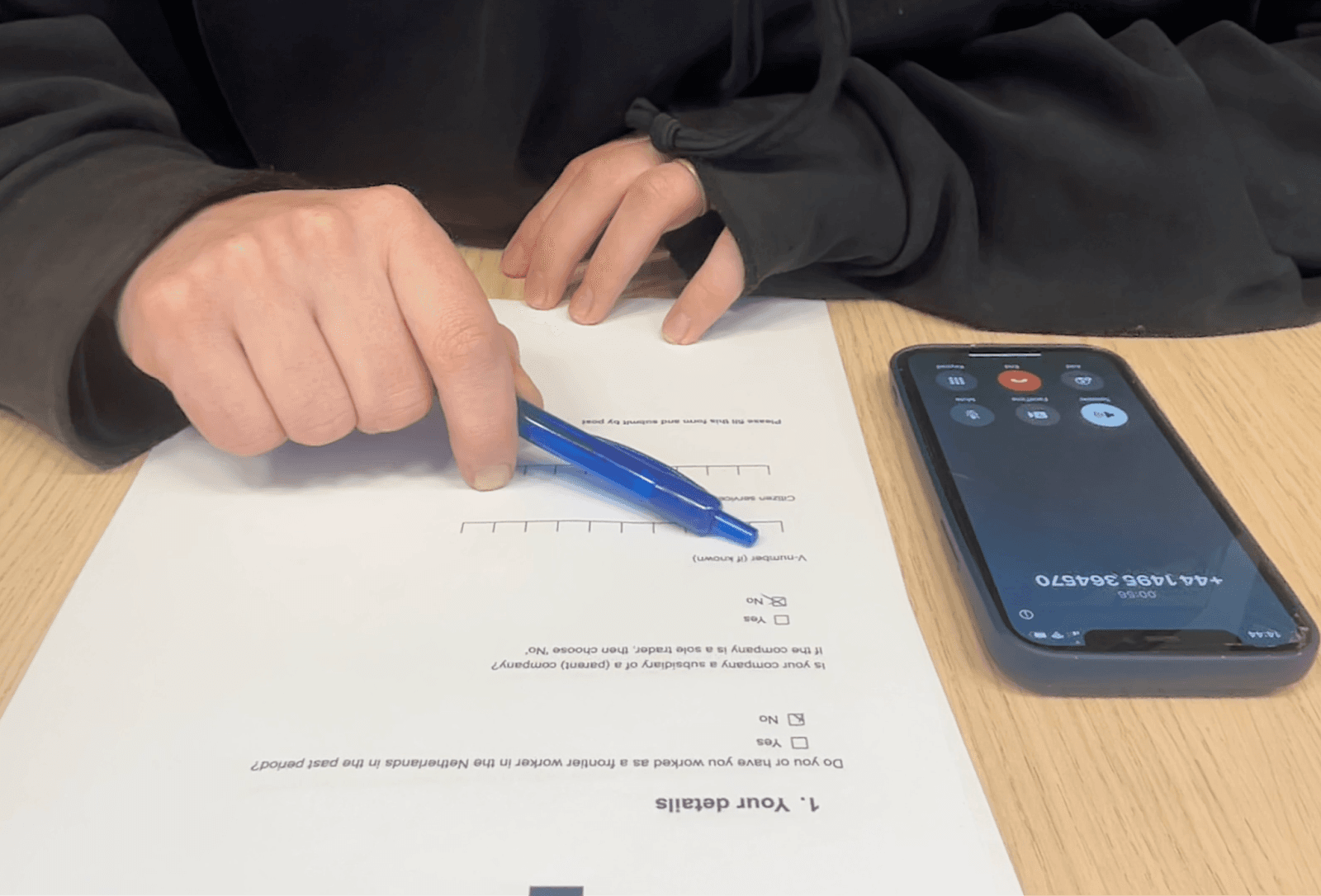 A prototype with a phone and paper tax form