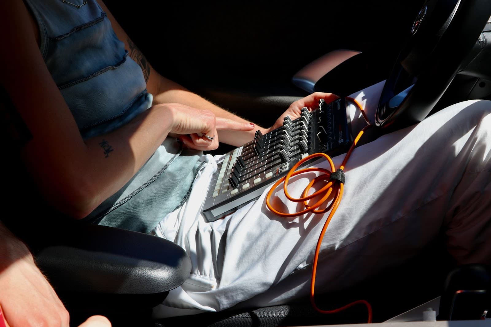 A participant designing a trustworthy voice sitting in a car